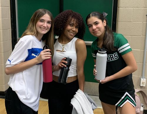 Three CHS Students Holding Reusable Water Bottles